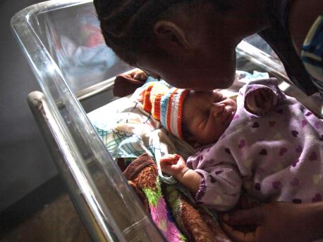 Akosusu Siska kisses her one day old baby, Reagen, in the UNICEF-supported Jules Chevalier clinic in Mbandaka, Équateur Province, the Democratic Republic of the Congo (DRC).