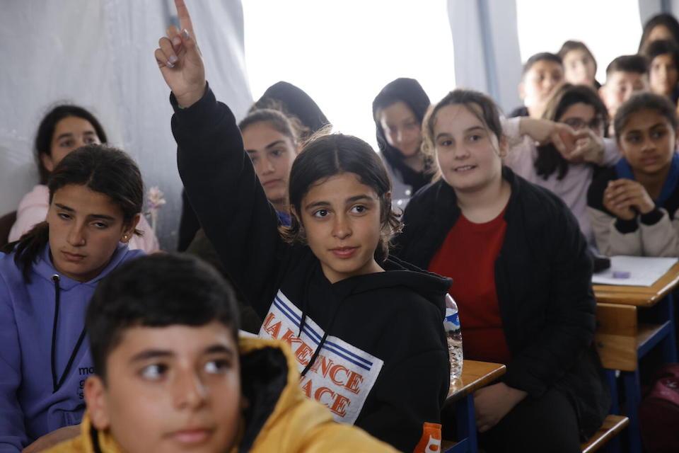 Kids in Türkiye who were displaced by a massive earthquake attend class inside a Child-Friendly Space set up by UNICEF.